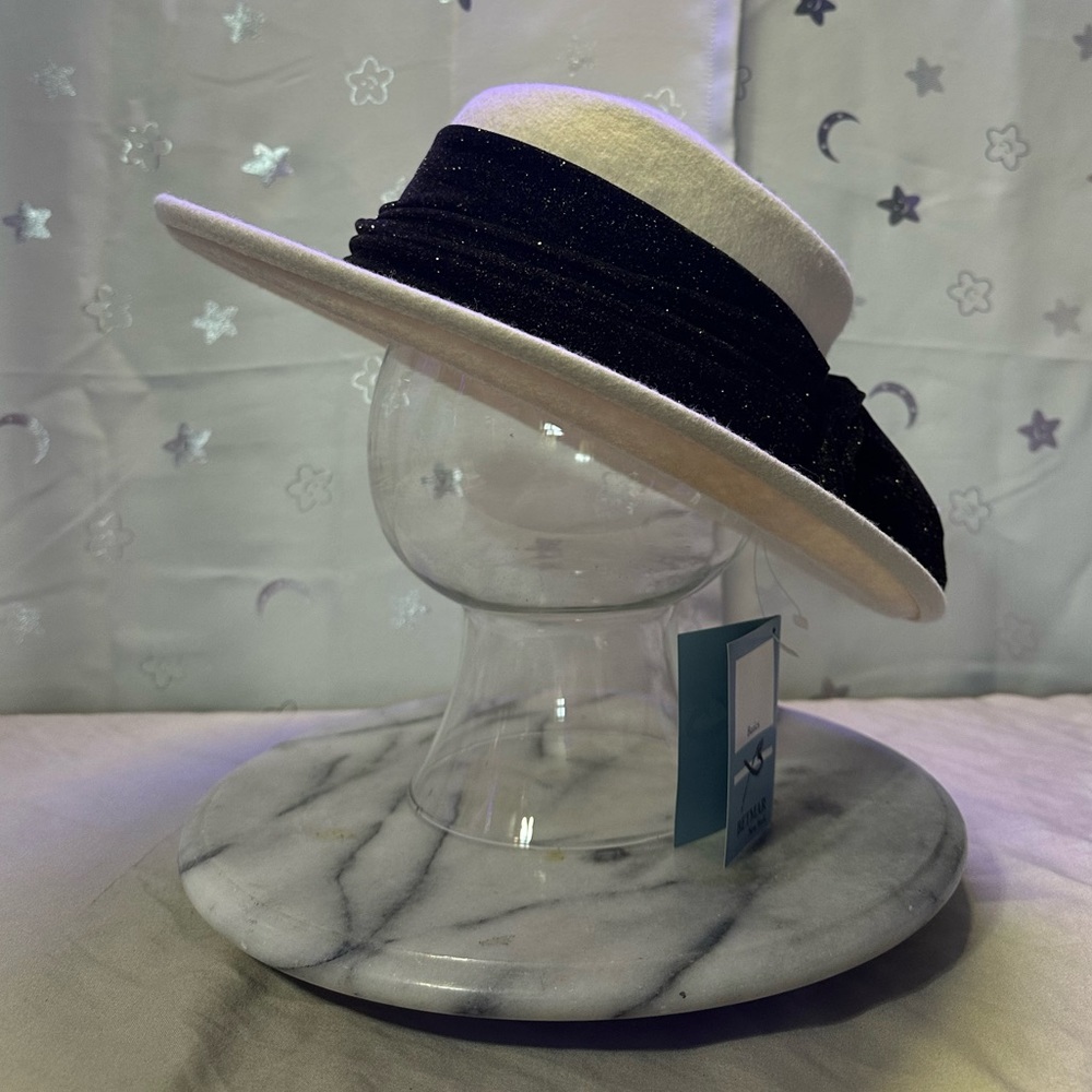 Betmar New York ladies hat cream color with attached black sparkling hat band